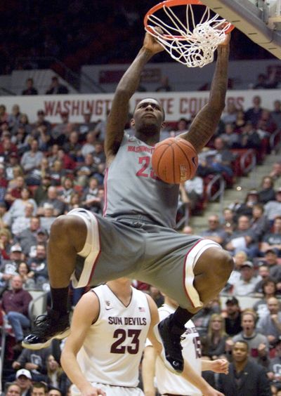 Washington State’s D.J. Shelton dunks during the second half of the Cougars’ pasting of Arizona State. (Associated Press)