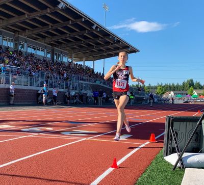 North Central’s Allie Janke crosses the finish line to win the State 3A girls 1,600-meter race on Thursday in Tacoma. (@wiaawa / Twitter)