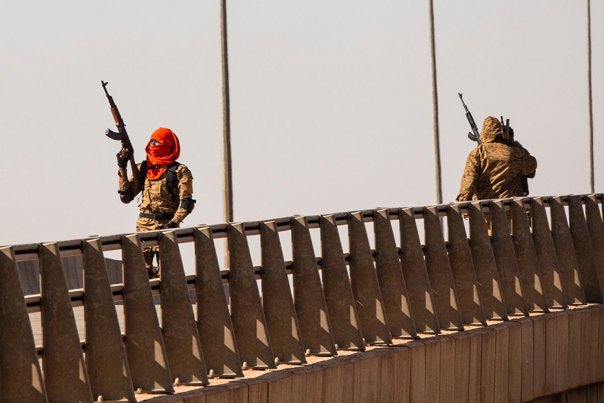 A mutinous soldier fires into the air at the Bobo interchange, near the Lamizana camp in Burkina Faso