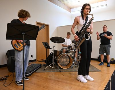 Teacher Brendan McMurphy, far right, watches as bassist Andrew Atkison, drummer Olin Young and saxophonist Thomas Stenzel launch into an original tune by Stenzel during an All-City Jazz Ensembles rehearsal Thursday at Holy Names Music Center in Spokane.  (Jesse Tinsley/The Spokesman-Review)