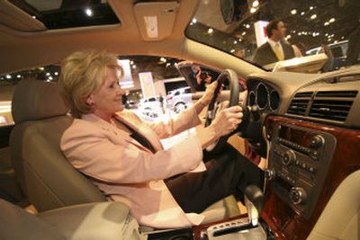 Transportation Secretary Mary Peters sits in a 2007 Saturn Aura at the New York International Auto Show on Thursday. The car is equipped with electronic stability control, which will be mandatory in the U.S.
(Associated Press / The Spokesman-Review)