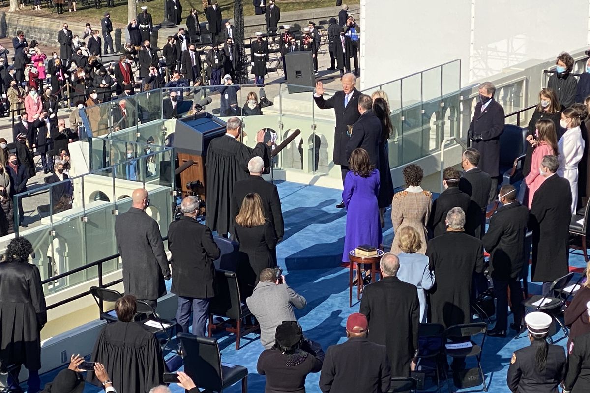 Joe Biden is sworn in as the 46th president of the United States by Chief Justice John Roberts as Jill Biden holds the Bible during the 59th Presidential Inauguration at the U.S. Capitol in Washington, Wednesday, Jan. 20, 2021.  (ROB CURLEY/THE SPOKESMAN-REVIEW)