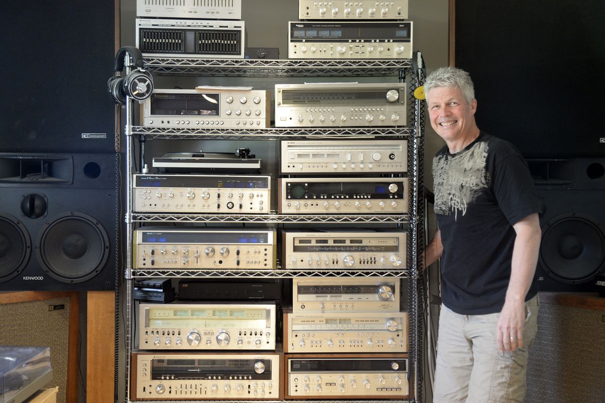 Gary Sauther, who buys and sells classic stereo equipment, also collects the best of the 1970s hi-fi equipment and listens to them in his basement. He poses Friday with his collection at his Spokane Valley home. (Jesse Tinsley)