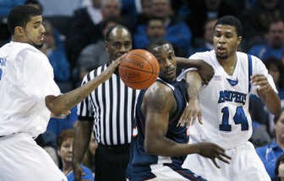 
Pepperdine's Tyrone Shelley tries to snag a pass from Memphis' Shawn Taggart, left, to Chris Douglas-Roberts.Associated Press
 (Associated Press / The Spokesman-Review)