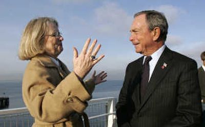 
New York Mayor Michael Bloomberg tours the Seattle Art Museum sculpture park Friday with director Mimi Gates. Bloomberg proposed a national 