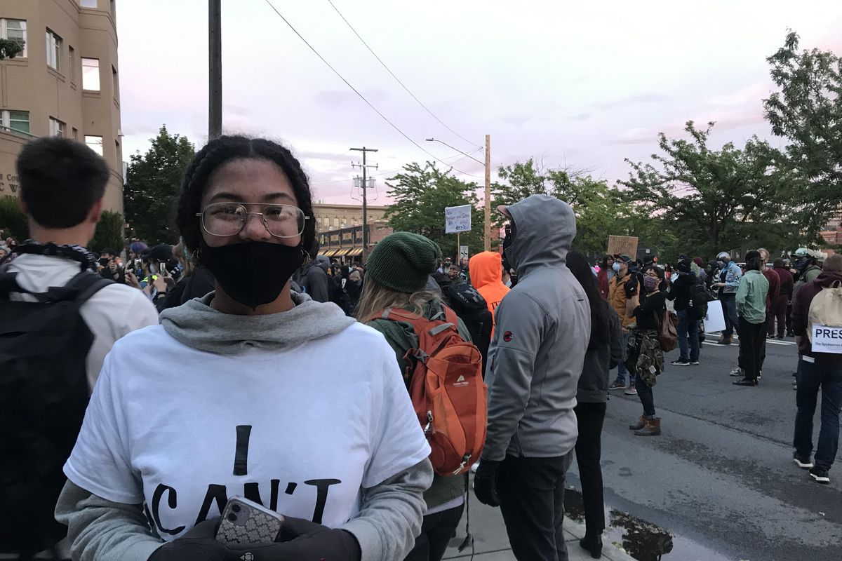 Simone Richardson, 19, stopped a group of protesters from burning a piece of fabric with the American flag during protests on Sunday, June 7, 2020. (Emma Epperly / The Spokesman-Review)