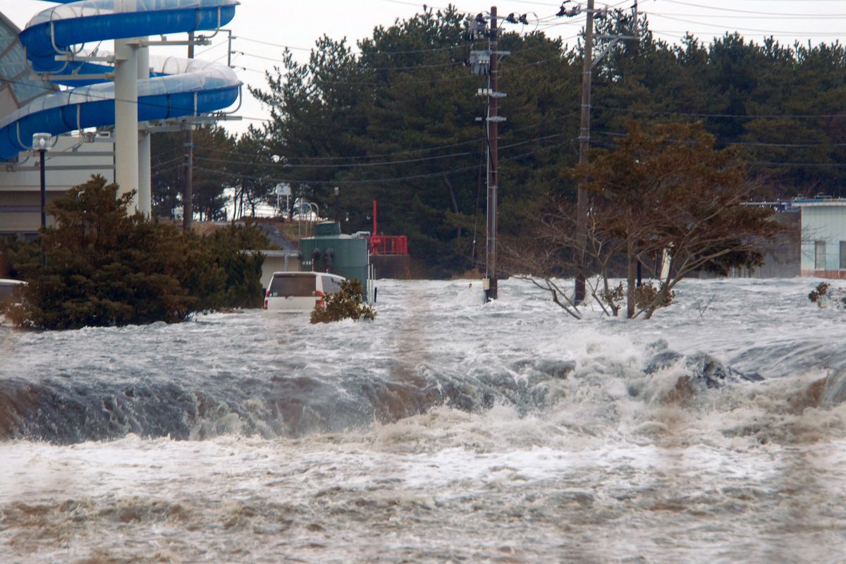 The area is flooded by tsunami in Iwaki, Fukushima Prefecture (state) as Japan was struck by a magnitude 8.9 earthquake off its northeastern coast Friday, March 11, 2011. (Kyodo News)
