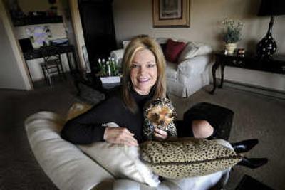 
Rebecca Bales holds her dog Lexy at her Spokane condo  April 3. Bales has started a personal assistance business called stressZero. 
 (CHRISTOPHER ANDERSON / The Spokesman-Review)