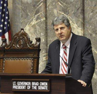 OLYMPIA -- WSU Football Coach Mike Leach addresses the state Senate after a resolution honoring the 1915 football team was adopted. (Jim Camden)