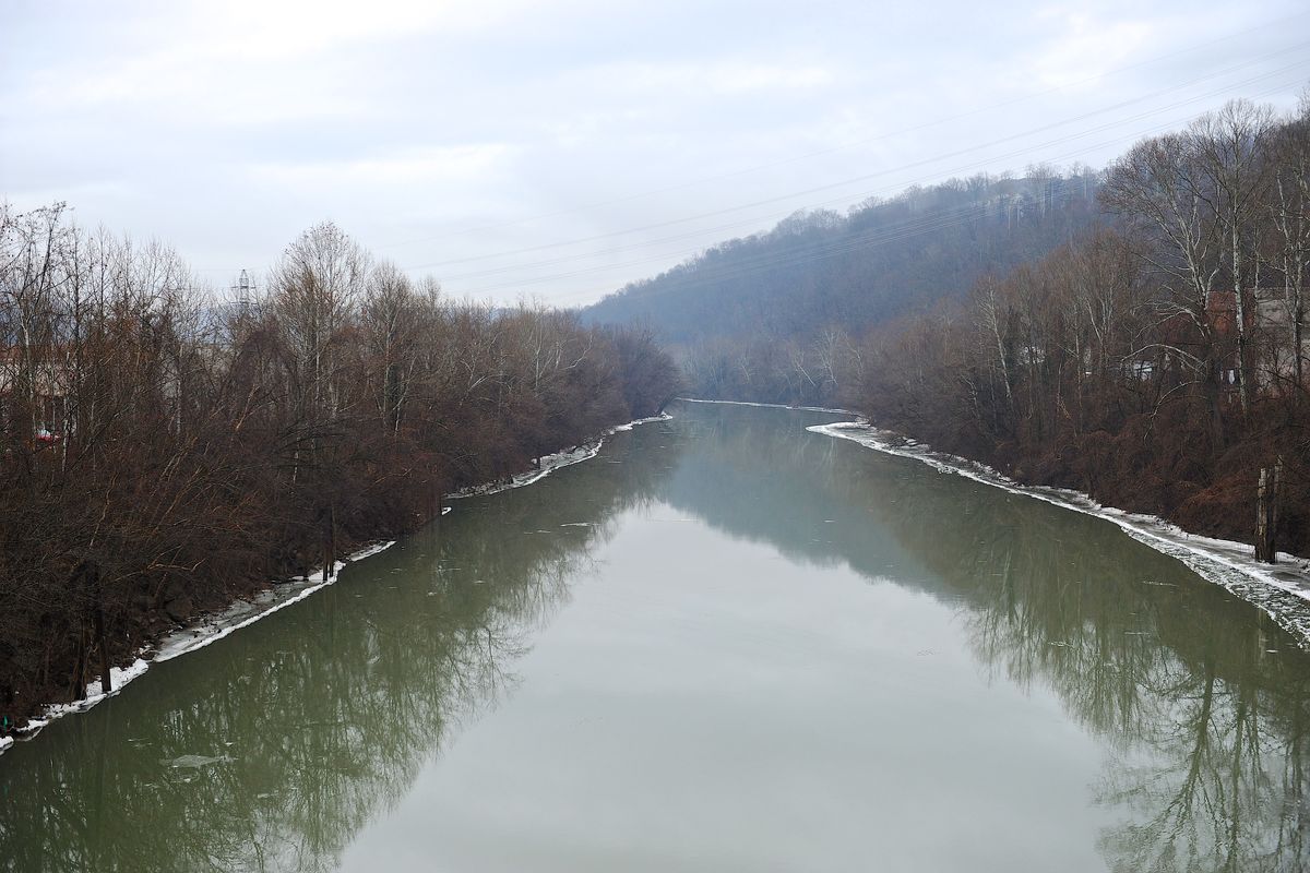 A stretch of the Elk River in Charleston, W.Va., is shown Friday, Jan. 10, 2014. The White House has issued a federal disaster declaration in West Virginia, where a chemical spill in the Elk River that may have contaminated tap water has led officials to tell at least 300,000 people not to bathe, brush their teeth or wash their clothes. The West Virginia National Guard planned to distribute bottled drinking water to emergency services agencies in the nine affected counties. About 100,000 water customers, or 300,000 people total, were affected, state officials said. (Tyler Evert / Fr170609 Ap)