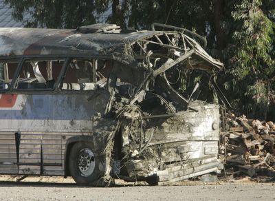 A charter bus that overturned Sunday is seen in a wrecking yard near Williams, Calif., on Monday.  (Associated Press / The Spokesman-Review)