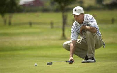 
Puyallup's Chris Ming lines up a putt on the third hole. 
 (Holly Pickett / The Spokesman-Review)