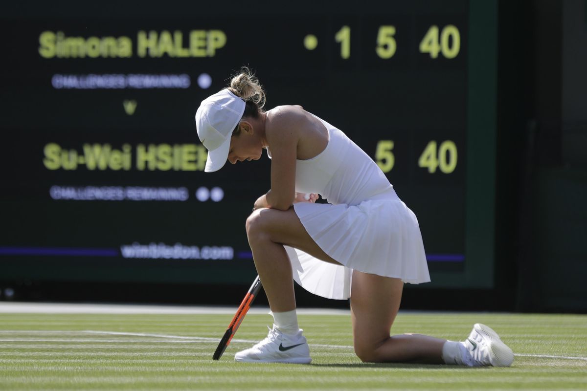 Simona Halep of Romania loses a point to Su-Wei Hsieh of Taiwan during their women’s singles match on the sixth day at the Wimbledon Tennis Championships in London, Saturday July 7, 2018. (Ben Curtis / Associated Press)