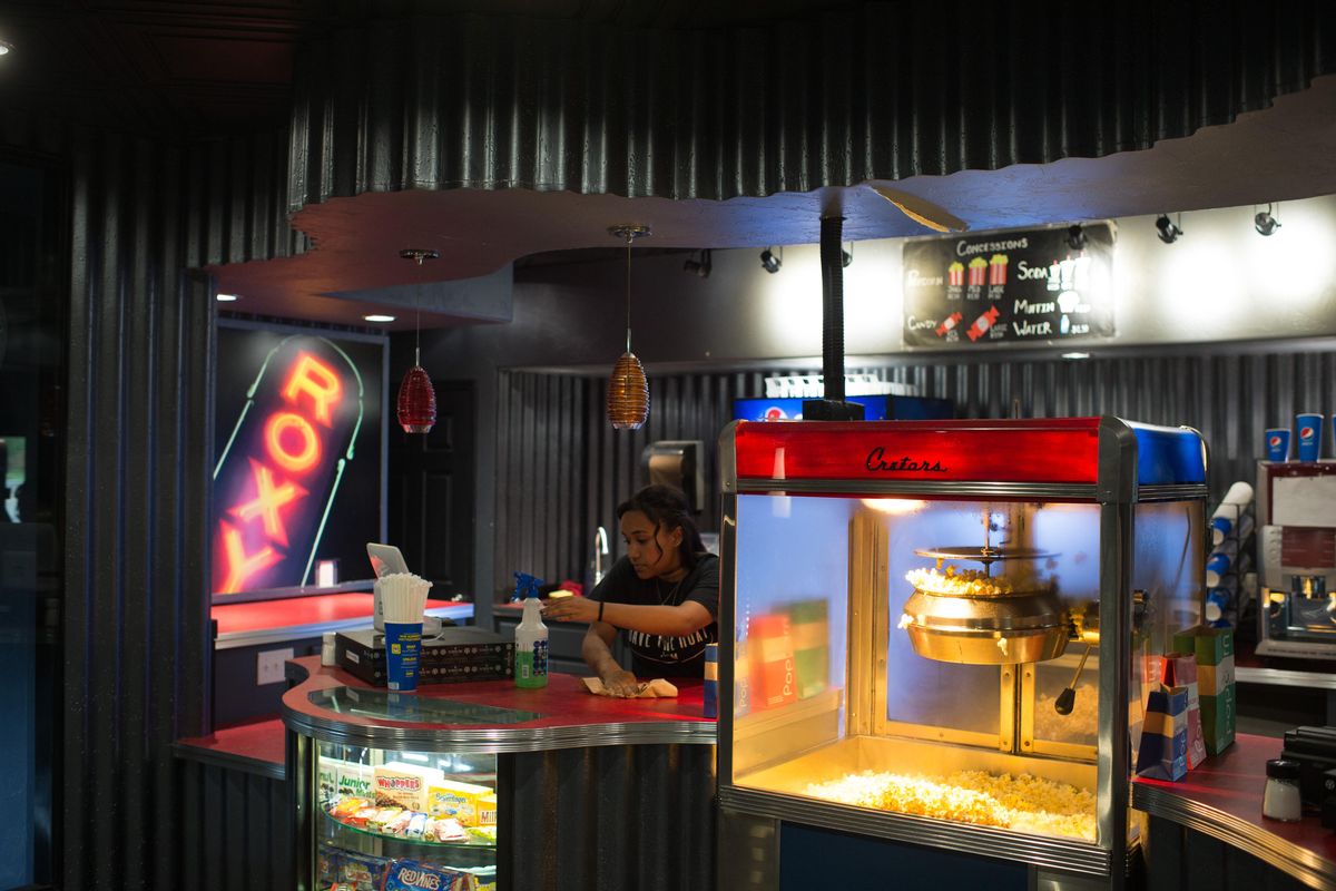 Alissa Jackson, prepares popcorn in the Roxy lobby on Wednesday, Aug. 16, 2017, in Newport, Wash. (Tyler Tjomsland / The Spokesman-Review)