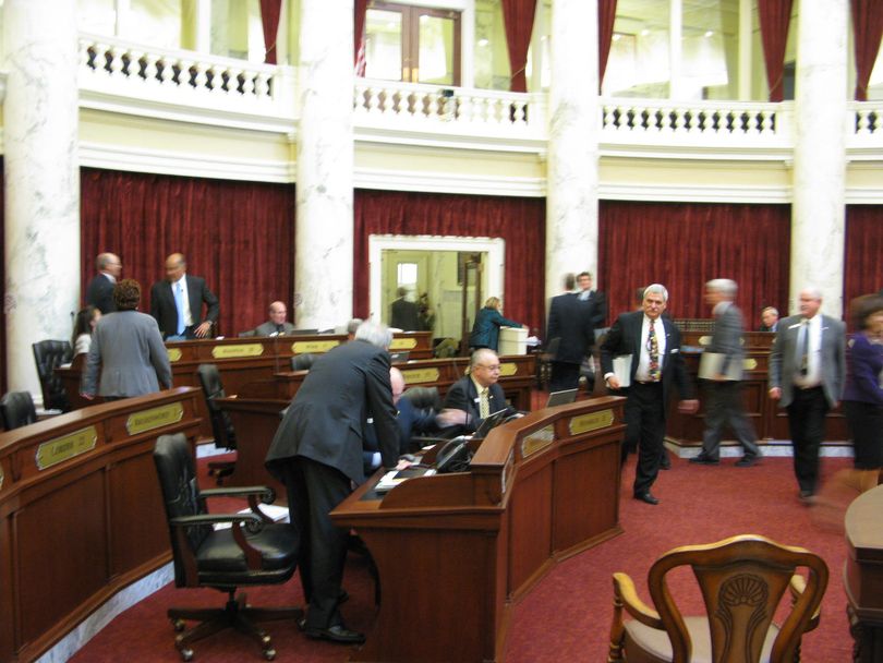 Senators, including Senate Education Chairman John Goedde, R-Coeur d'Alene, leave their seats Monday night after the two-hour debate on the public schools budget, which passed, 27-8. (Betsy Russell)