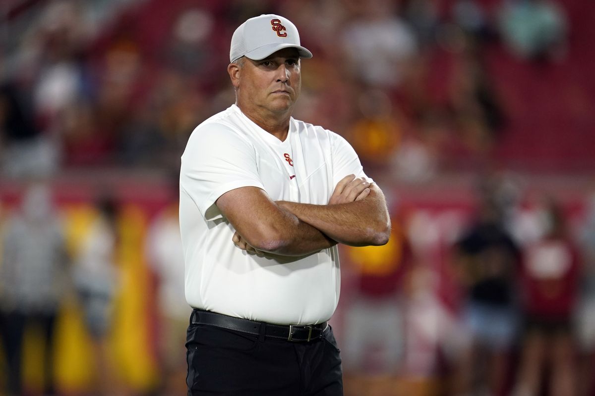 Southern California head coach Clay Helton watches warm ups on the field before an NCAA college football game against Stanford Saturday, Sept. 11, 2021, in Los Angeles.  (Associated Press)