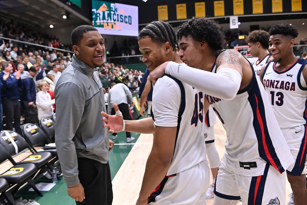 Former Gonzaga standout Zach Norvell Jr., left, celebrates with Bulldogs guards Rasir Bolton (45) and Julian Strawther after the Zags defeated San Francisco 77-75 on Jan. 5 at War Memorial Gym in San Francisco.  (Tyler Tjomsland / The Spokesman-Review)