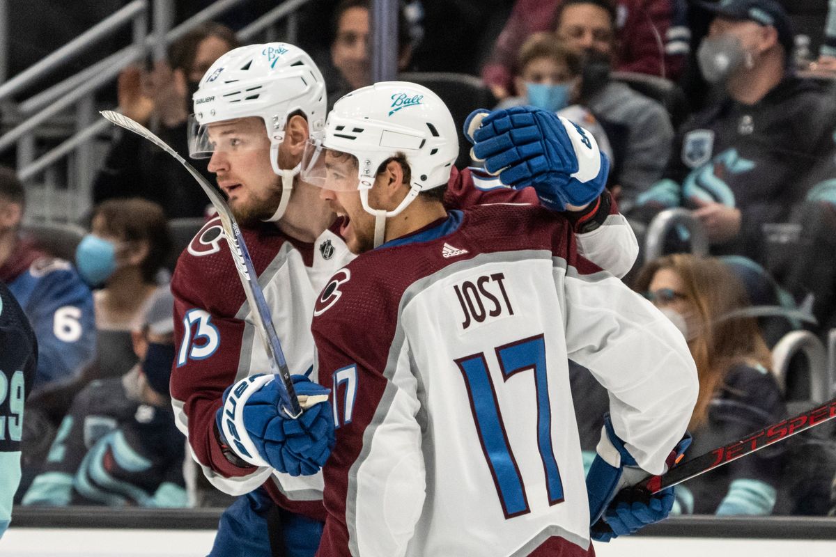 Colorado Avalanche right wing Valeri Nichushkin (13) and center Tyson Jost celebrate a short-handed goal by Nichushkin during the first period of an NHL hockey game against the Seattle Kraken, Friday, Nov. 19, 2021, in Seattle.  (Stephen Brashear)