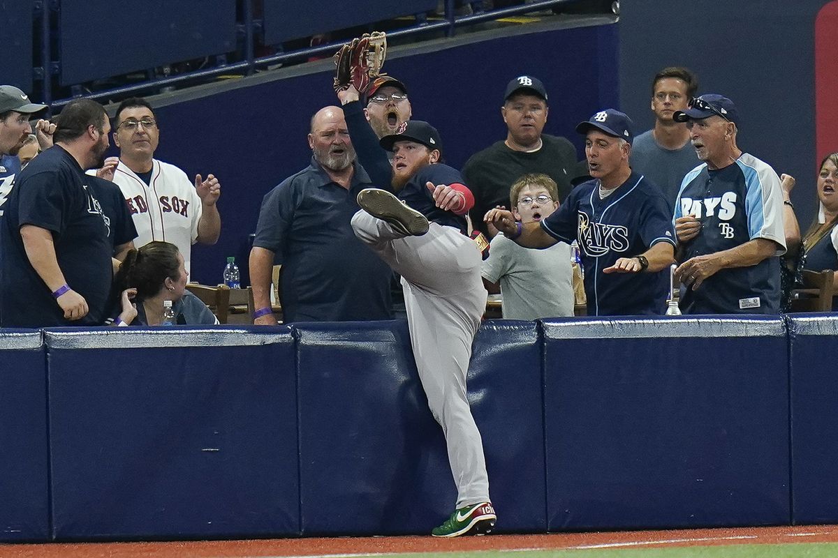 Boston Red Sox's J.D. Martinez, right, is greeted by Xander