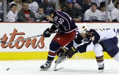 
Associated Press Atlanta's Eric Boulton, right, defends against Columbus' Jared Boll.
 (Associated Press / The Spokesman-Review)