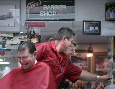 
 Jim Greene and Tom Groh share a laugh as Groh finishes Greene's haircut last week at Tom's Barber Shop in Spokane Valley. Groh has cut hair for almost 40 years. 
 (Liz Kishimoto / The Spokesman-Review)