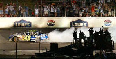 
Jimmie Johnson (48) does a burnout down the backstretch to celebrate his Coca-Cola 600 win.Jimmie Johnson (48) does a burnout down the backstretch to celebrate his Coca-Cola 600 win.
 (Associated PressAssociated Press / The Spokesman-Review)