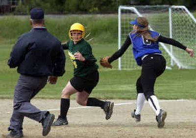 
Amanda North, (center) of Lakeland, finds herself in the pickle and was eventually tagged out by Sugar-Salem. 
 (Jesse Tinsley / The Spokesman-Review)