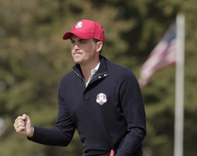 USA’s Keegan Bradley reacts after making a putt on the first hole during a four-ball match. (Associated Press)