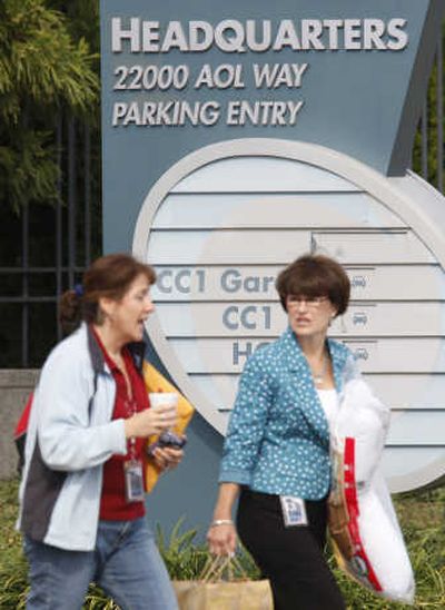 Unidentified women leave AOL headquarters in Dulles, Va., on Monday. AOL is reducing its global work force by 2,000 employees, or 20 percent, as it continues a transition from Internet access provider to online advertising company. Associated Press
(Associated Press / The Spokesman-Review)