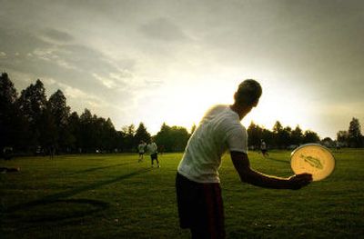 
Ultimate Frisbee players warm up at Franklin Park. Classic toys such as the Frisbee and Hula-Hoop are regaining some popularity.
 (File/ / The Spokesman-Review)