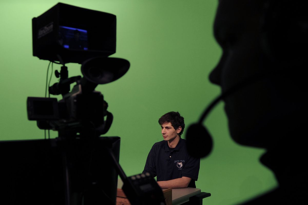 Central Valley High senior Chris Pittella, center, works the anchor position during the taping of CV’s weekly sports show on Monday. The show airs Thursdays at 10:35 p.m. on KAYU. (Kathy Plonka)
