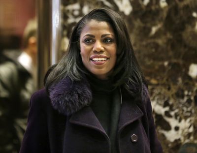 In this Dec. 13, 2016, file photo, Omarosa Manigault smiles at reporters as she walks through the lobby of Trump Tower in New York. Manigault Newman is following up her year in the White House with a stint on Celebrity Big Brother. CBS unveiled the cast of the reality shows upcoming season Sunday with a commercial that aired during the Grammy Awards. Besides Manigault Newman, other contestants include basketball star Metta World Peace and actresses Marissa Jaret Winokur and Keshia Knight Pulliam. (Seth Wenig / Associated Press)