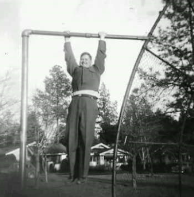 Cindy's father, Tom Burnett, doing some chin-ups in the early 1950s.