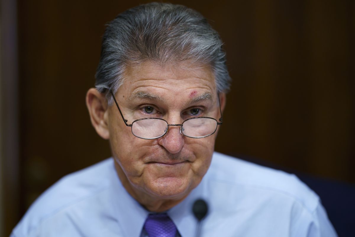 FILE - In this Aug. 5, 2021, file photo Sen. Joe Manchin, D-W.Va., prepares to chair a hearing in the Senate Energy and Natural Resources Committee, as lawmakers work to advance the $1 trillion bipartisan bill, at the Capitol in Washington. Manchin said Thursday, Sept. 2, that Congress should take a “strategic pause” on more spending, warning that he does not support President Joe Biden