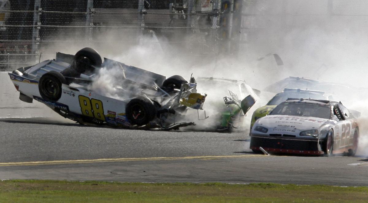 Driver Dale Earnhardt Jr. (88) flips as Brad Keselowski (22) drives past during the Nationwide series race at Daytona on Saturday. (Associated Press)