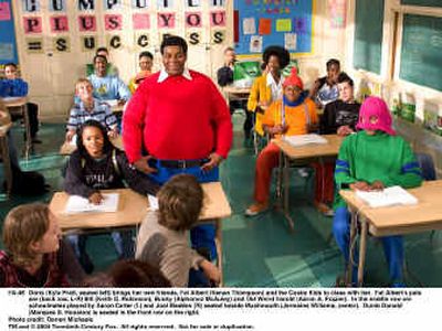 
Doris (Kyla Pratt), seated left, brings her new friends, Fat Albert (Kenan Thompson) and the Cosby Kids, to class with her. 
 (Photo courtesy of 20th Century Fox / The Spokesman-Review)