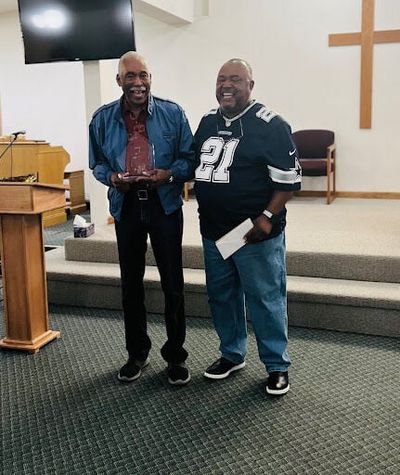 Ernest McClain, left, is honored by Pastor Benjamin Watson, Sr., at Bethel A.M.E.  (April Eberhardt)