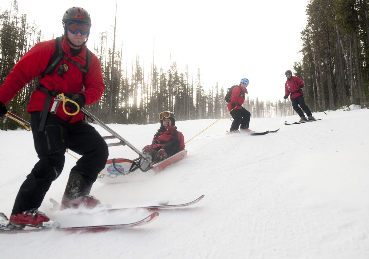 Mt. Spokane Ski Patrol members, from front, Justin Slawson, Carolann Christensen, Jacqueline Essig and David Christenson practice rescue toboggan training. (Colin Mulvany / The Spokesman-Review)