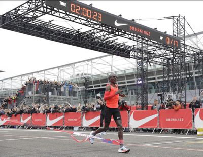 In this Saturday, May 6, 2017 file photo, Olympic marathon champion Eliud Kipchoge crosses the finish line of a marathon race at the Monza Formula One racetrack, Italy. Eliud Kipchoge was 26 seconds from making history on May 6. Nike and Adidas have announced separate plans to attack the 2-hour marathon, with both introducing shoe lines linked to the effort. Wireless tech giant Vodafone last month said it was backing a third bid, hoping data gleaned from the quest will translate into wearable technology. (Luca Bruno / Associated Press)