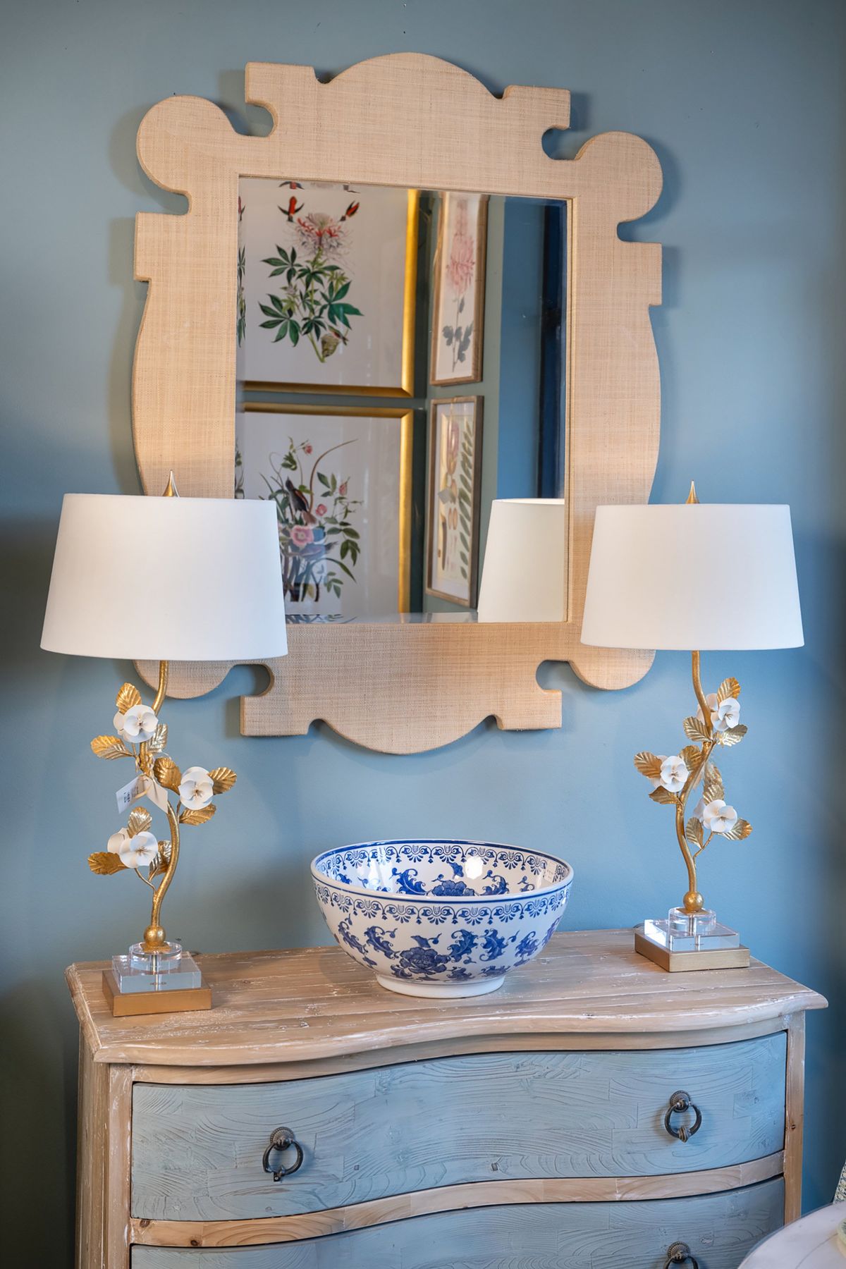 Feature larger pieces or mirrors over chests, as they break up the space and add help define a space (or create a new one).  (Courtesy photo)