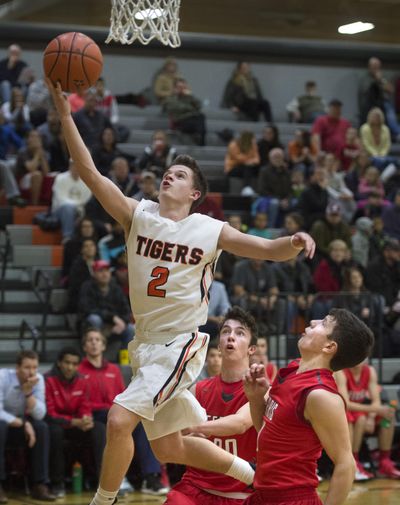 Justin Martin of Lewis and Clark soars to the basket against visiting Ferris on Dec. 15, 2015. Martin set the NAIA Division II single-game scoring record with 71 points on Dec. 4  in Multnomah’s 126-124 win over Warner Pacific. (Dan Pelle / The Spokesman-Review)