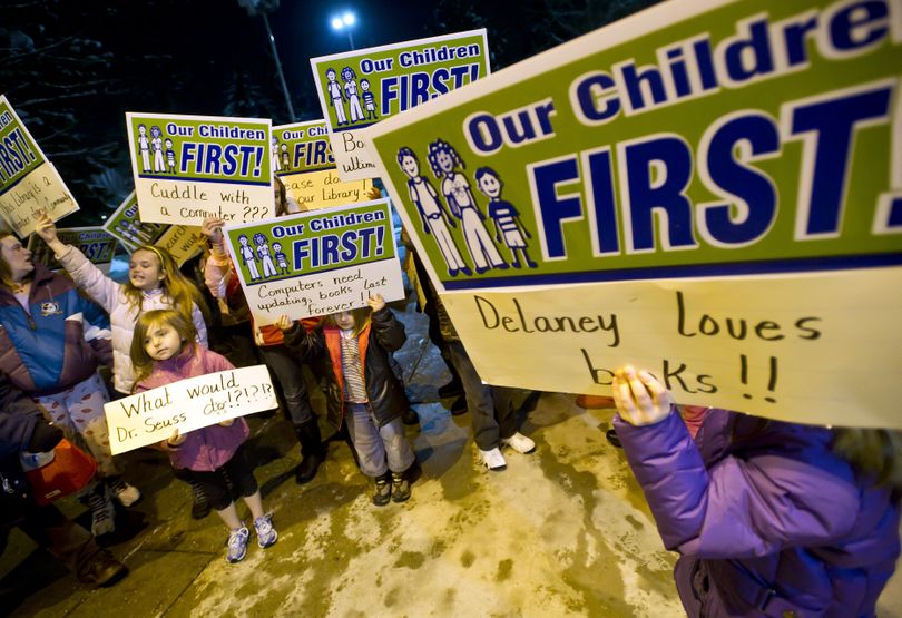 In front of Spokane City Hall, students from Sheridan and Franklin elementary schools and Chase Middle School protest the proposed closure of the East Side Library on Monday.  (Colin Mulvany)