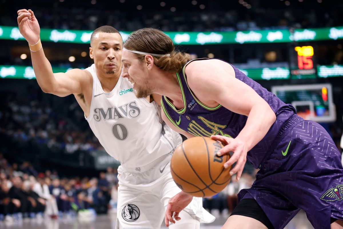 New Orleans Pelicans forward Kelly Olynyk drives against Dallas Mavericks guard Dante Exum on Feb. 21 at the American Airlines Center in Dallas. Olynyk was traded from the Toronto Raptors with Bruce Brown on Feb. 6 in exchange for Brandon Ingram. (Tribune News Service)