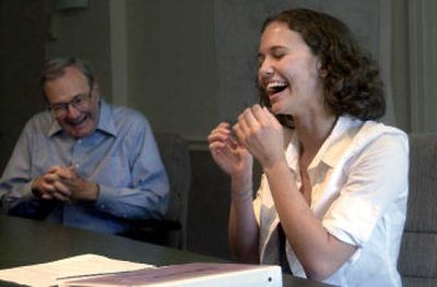 
Josi Speer a Coeur d'Alene Charter Academy graduate who recently attended Idaho Business Week shares a laugh with bankcda board member, Charles Clock, who recommended Speer for the bank's only sponsorship this year. 
 (Tom Davenport/ / The Spokesman-Review)