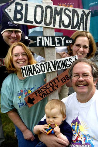 
Clockwise from top right, Sarah Lemmon, Steve Storebo, 10-month-old Lucas Lemmon, Pam Storebo and Rob Lemmon expect 20 of their relatives to descend on their home for Bloomsday from places as far away as New York, Arizona, California and North Dakota. 
 (Holly Pickett / The Spokesman-Review)
