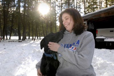 
Brittany Fincher, of Athol, now owns Chance,  a black Lab who was rescued after being buried under a concrete slab. 
 (Jesse Tinsley / The Spokesman-Review)