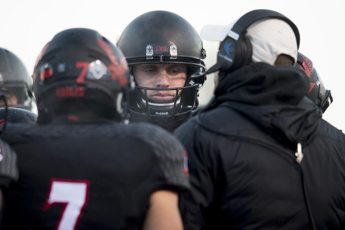 Eastern Washington Eagles wide receiver Cooper Kupp (10) listens to final pointers from head coach Beau Baldwin before the first half of a FCS football game against Youngstown State on Saturday, Dec 17, 2016, at Roos Field in Cheney, Wash. (Tyler Tjomsland / The Spokesman-Review)