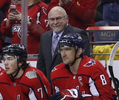 In this March 12, 2018, file photo, Washington Capitals head coach Barry Trotz smiles towards left wing Alex Ovechkin, right, after Ovechkin’s goal in the second period of an NHL hockey game against the Winnipeg Jets in Washington. Ovechkin is finally past the second round of the playoffs. So is coach Trotz. (Alex Brandon / Associated Press)