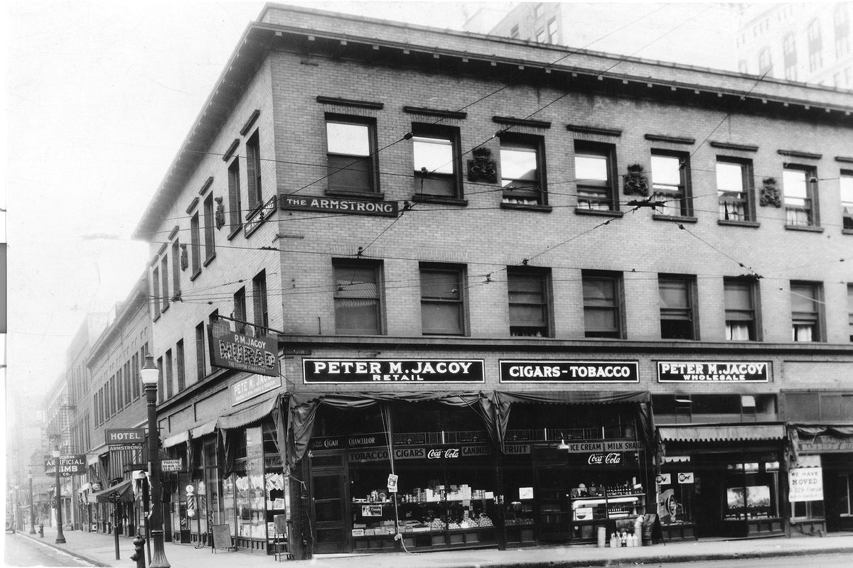 1915: P.M. Jacoy Retail opened in 1897 as the Washington Cigar Store at 228 N. Washington St.