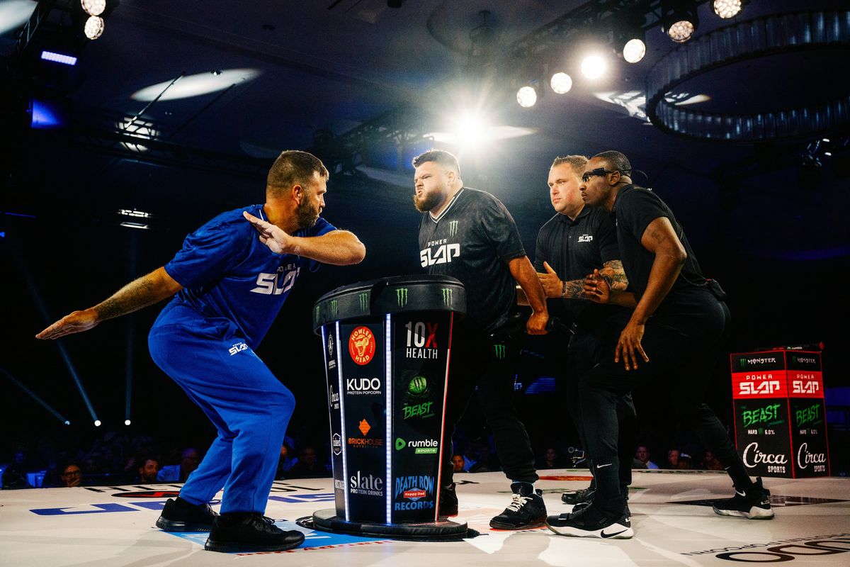 Vern “The Mechanic” Cathey prepares to slap Austin “Turp Daddy Slim” Turpin at the eighth Power Slap event in Las Vegas on June 28. The business team behind the Ultimate Fighting Championship is betting big on Power Slap, a new and extremely dangerous competition with many detractors.  (New York Times)